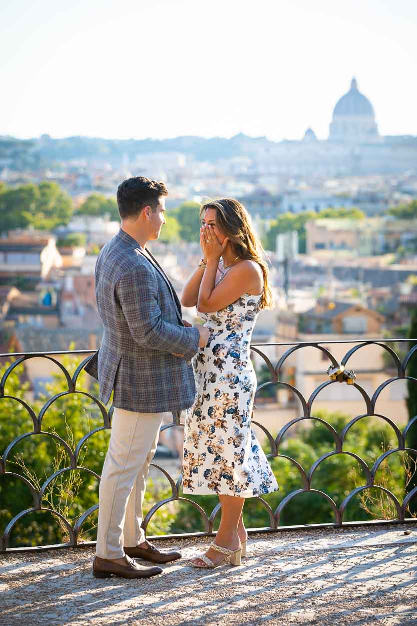 Surprised by a marriage proposal asked in overlooking the city of Rome Italy at sunset 