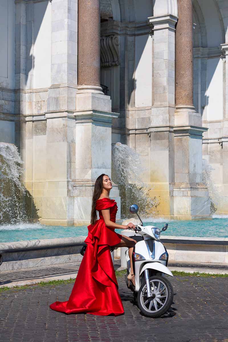 Bright red dress used during a photo shoot in Rome by the Janiculum hill water fountain 