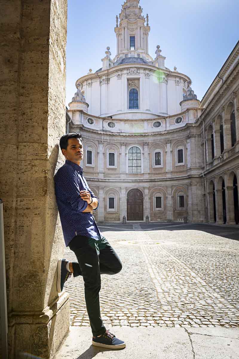 Standing and leaning on the side in the courtyard of Sant'Ivo alla Sapienza