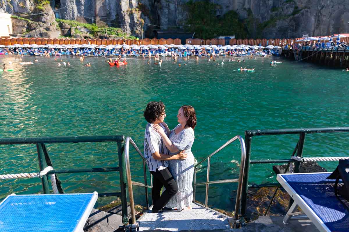 Couple posed together in front of the sea of Sorrento in Italy