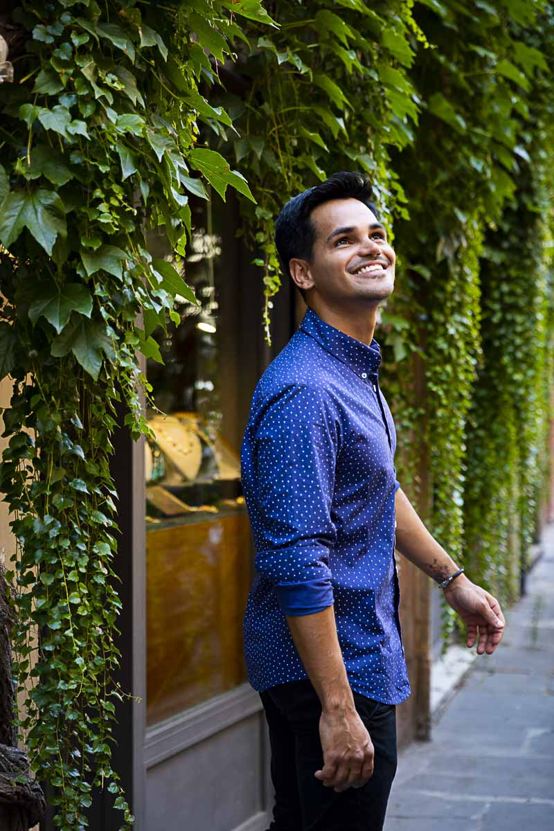 Posing by green Ivy leaves found on the streets of Rome Italy while walking during a model photo shoot in Rome Italy