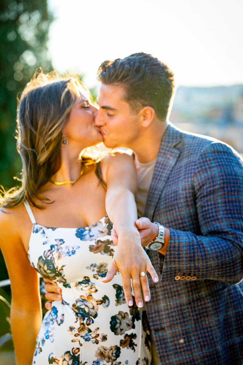 Couple closeup holding the engagement ring after a wedding marriage proposal