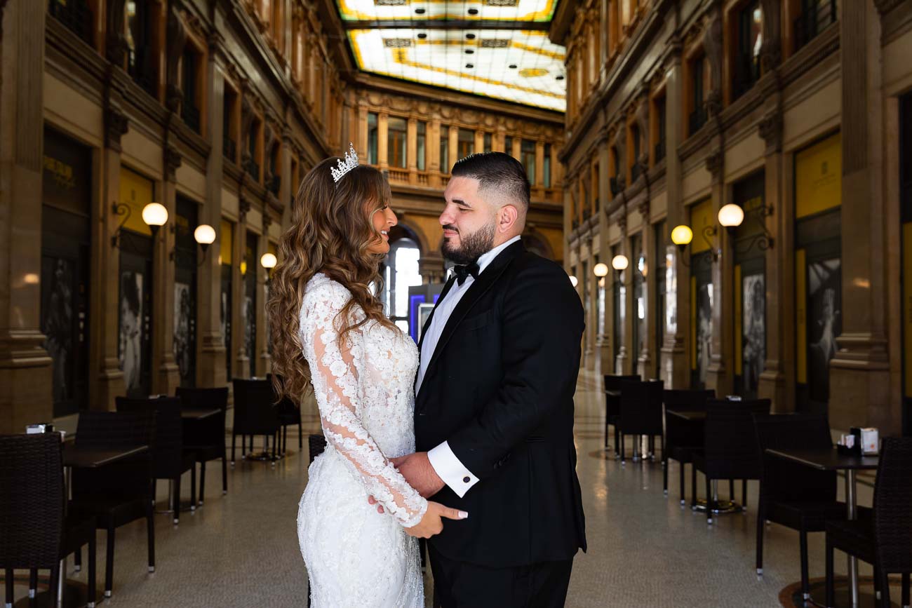 Bride and Groom standing together facing each other while taking their wedding pictures in Rome Italy