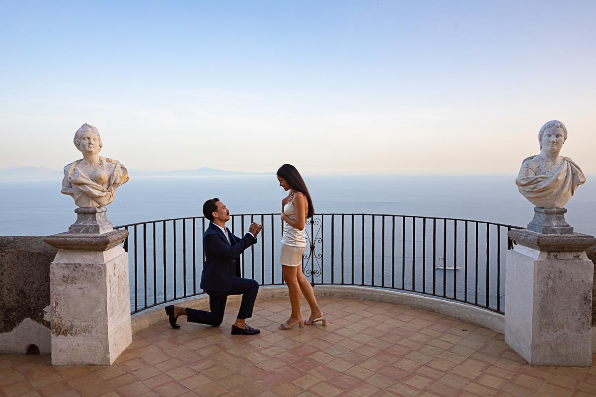 Knee down wedding marriage proposal photographed at the Terrace of Infinity of Villa Cimbrone in the town of Ravello on the Amalfi coast