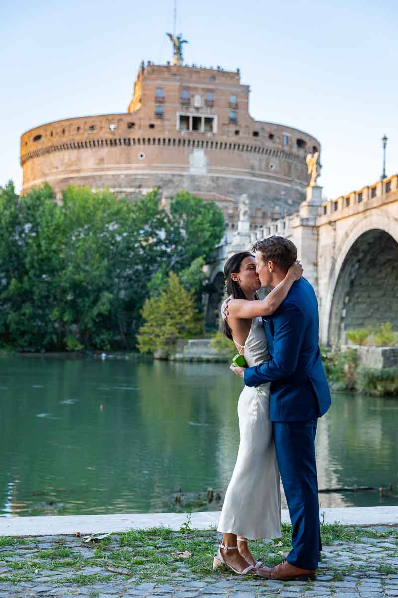 The moment that she said yes welcomed with a romantic kiss overlooking the bridge and the castle 