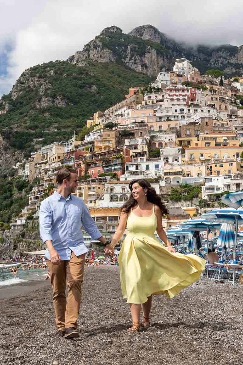 Walking together on the beach of Positano on the Amalfi coast