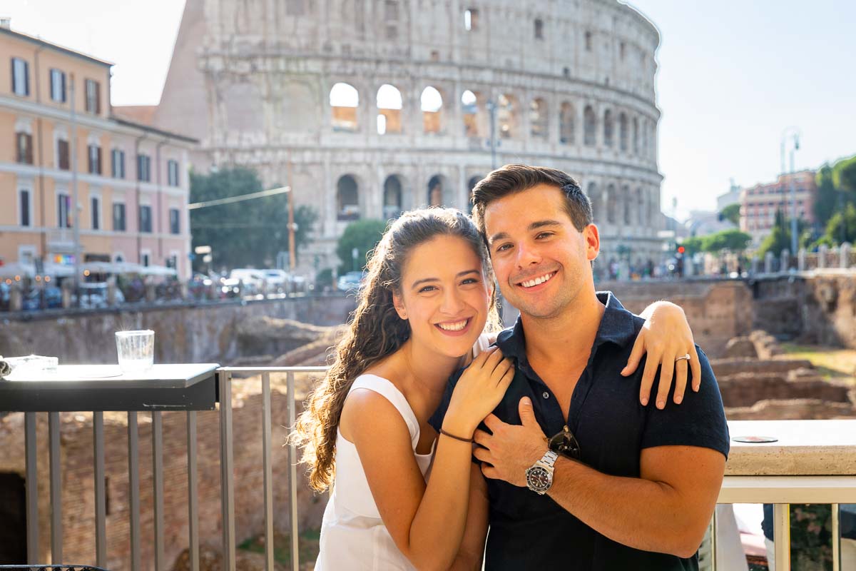 Couple portrait picture posing for a photo in front of the Roman Colosseum 