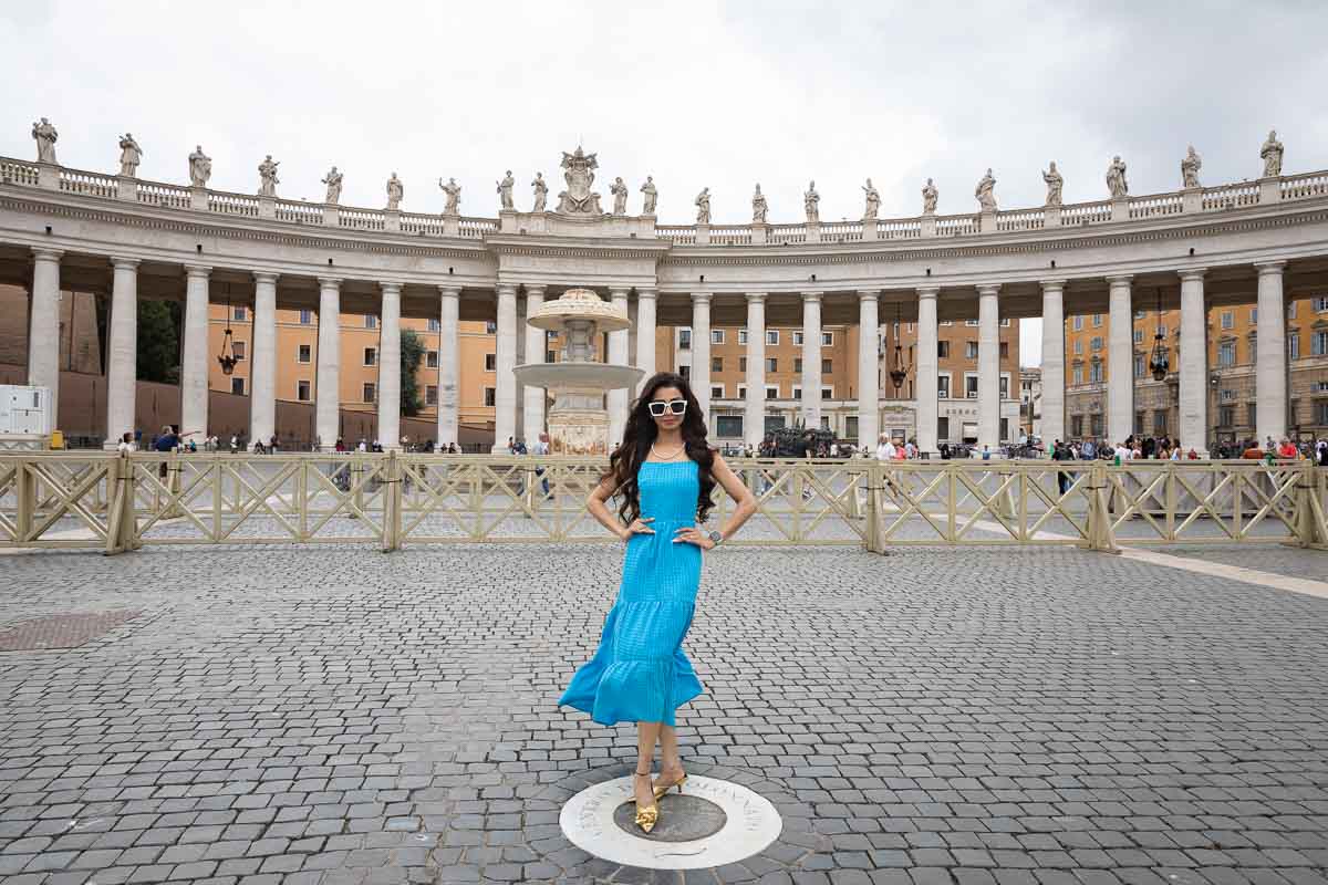 Standing in the center of square where the background columns aline into one. Travel lifestyle photography in Rome Italy