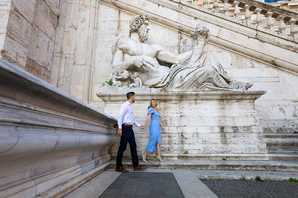 Walking underneath an ancient roman marble statue 