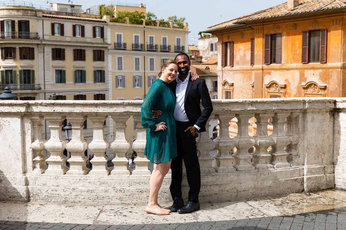 Posed portrait standing in front of marble balconade in Piazza di Spagna. Roma