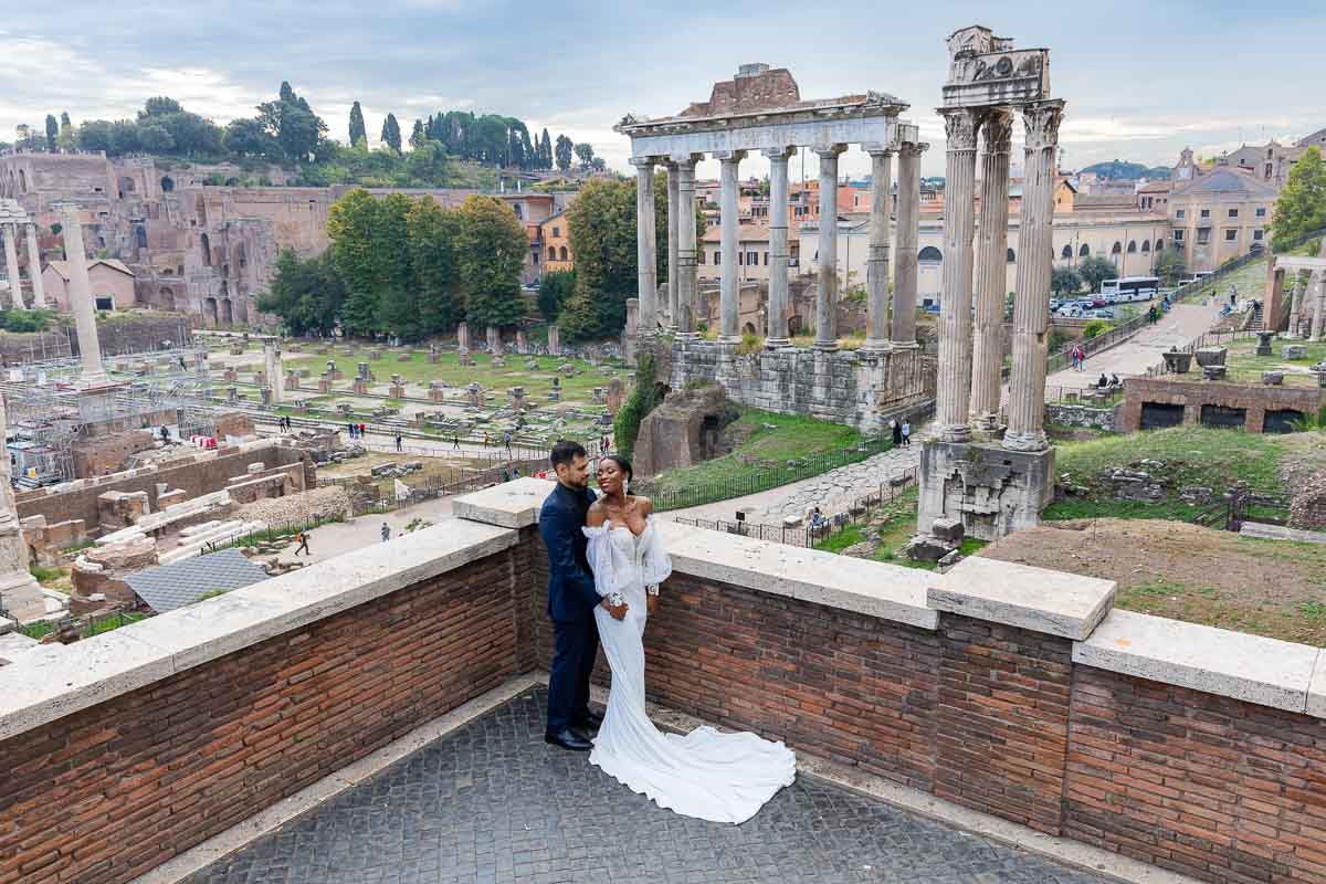 Posed couple portrait in front of the Roman Forum in Rome Italy