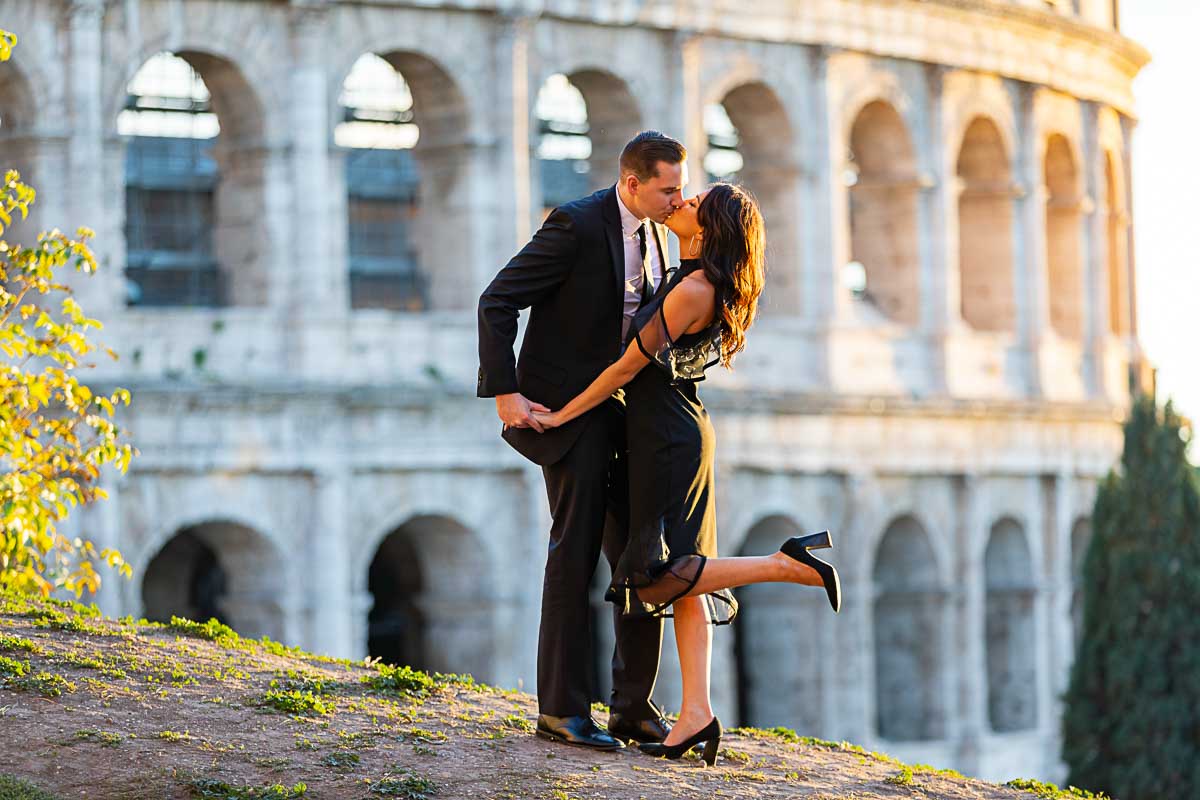 Colosseum couple photo shoot at sun set in Rome Italy wearing black formal attire 