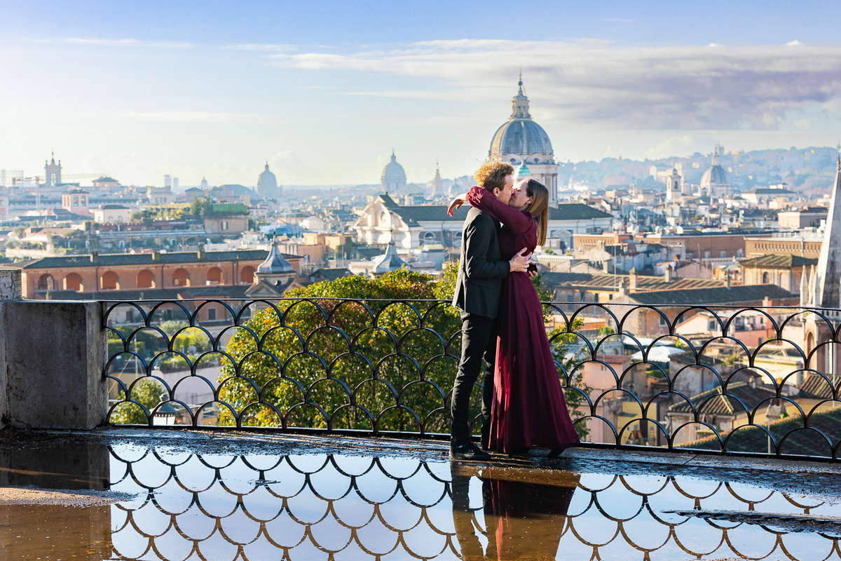 She said yes moment photographed at Villa Borghese parco del Pincio. In front of a stunning view of the city of Rome at sunrise