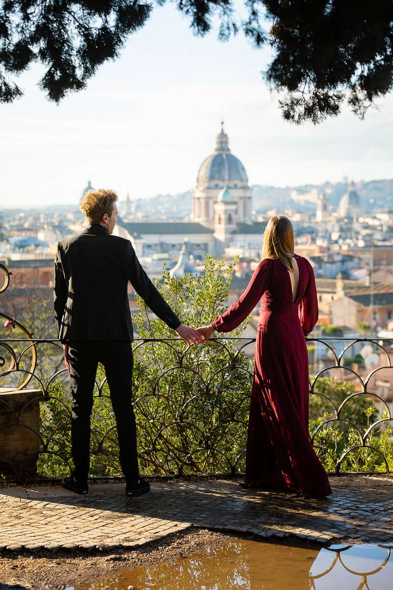 Holding hands during an engagement photoshoot. Secret Engagement Photoshoot in Rome Italy