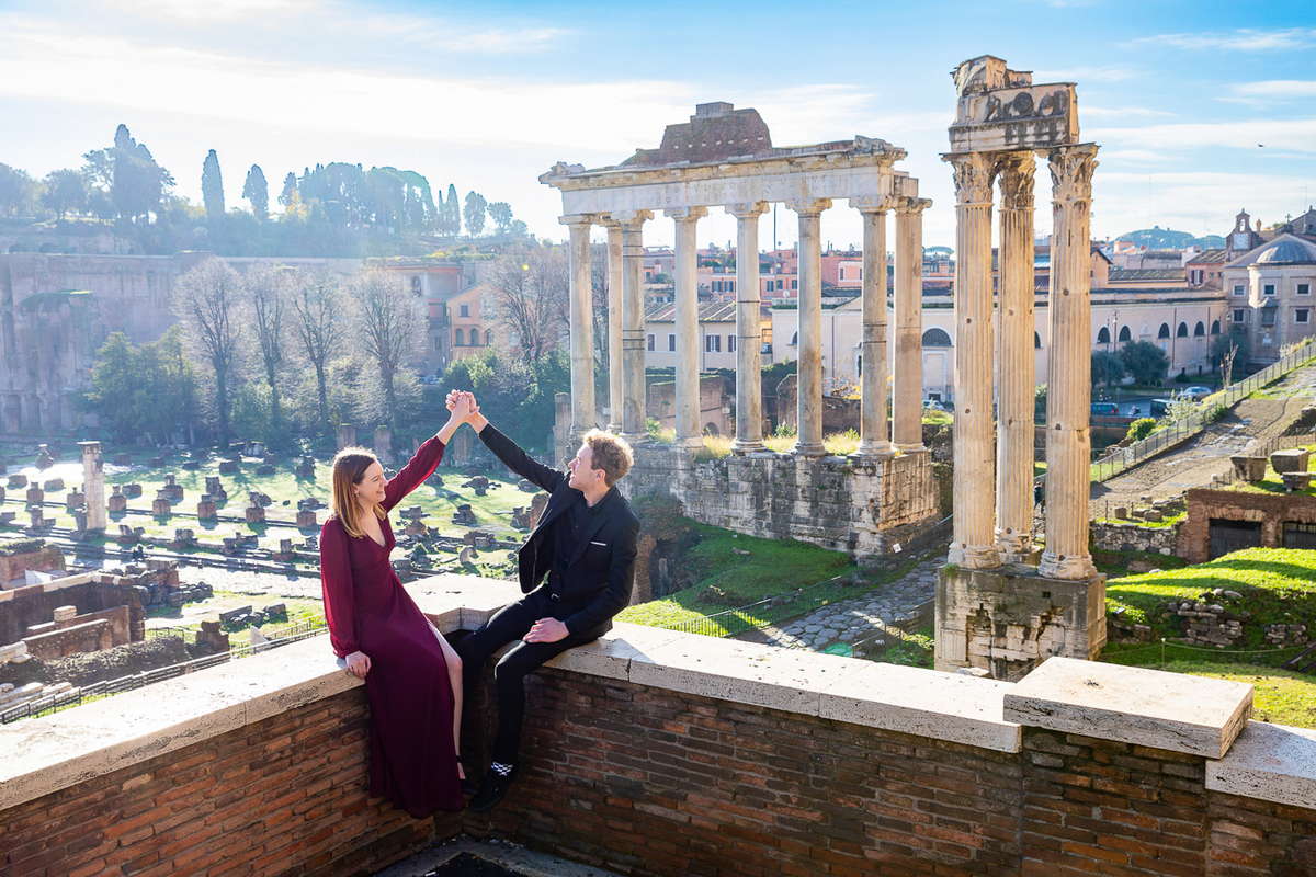Holding hands together by the Roman Forum during a photo shoot in Rome Italy