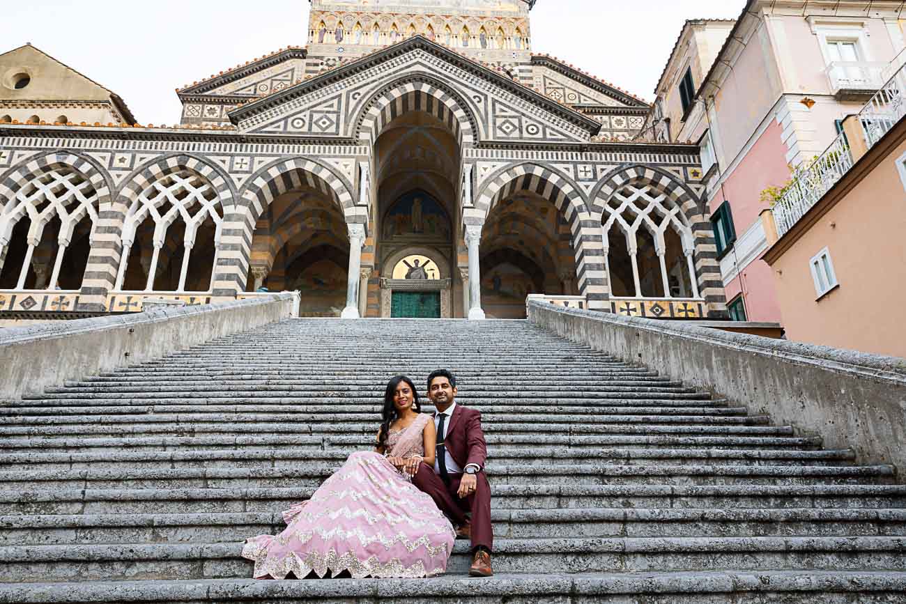 Sitting down Couples Photo in Amalfi and Positano taken on the steps of the Cathedral of Amalfi on the Amalfi coast in Italy