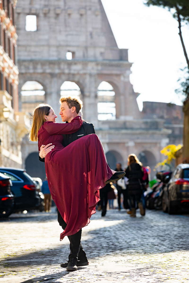 In love in Rome. Walking together on a cobblestone alleyway during a photo session in Rome Italy