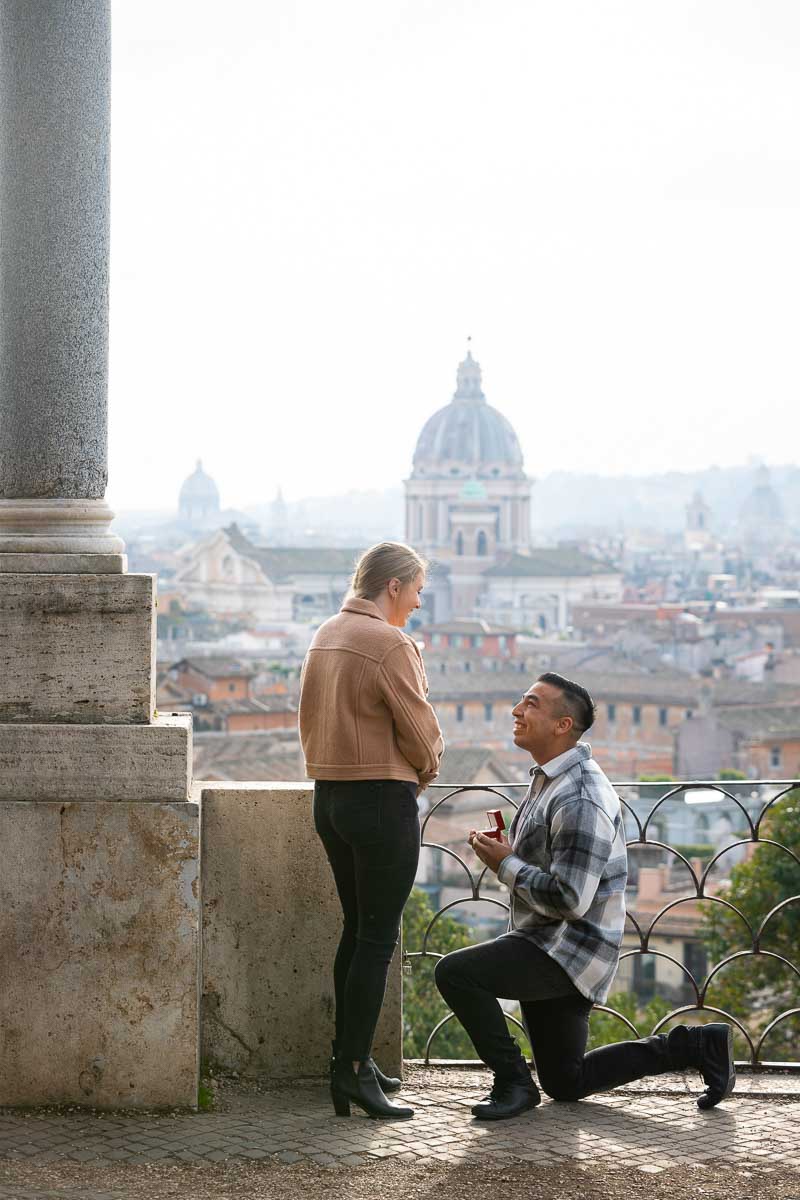 Surprise wedding marriage proposal candidly photographed at the Pincio park outlook. Proposing at Parco del Pincio