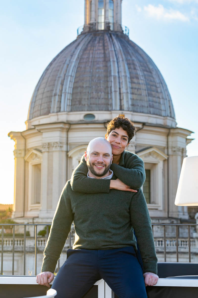 Couple portrait close up with a church dome in the background at sunset