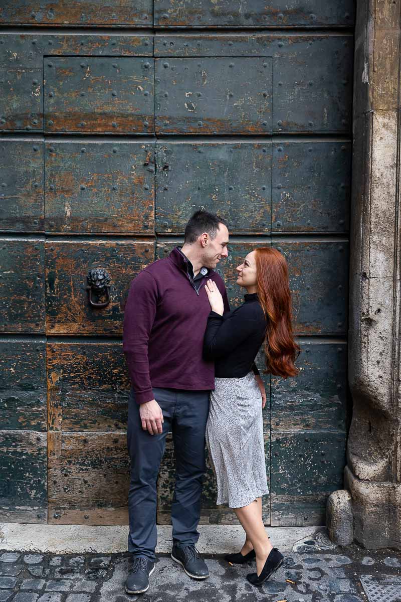 Engagement photography in front of an ancient green door 