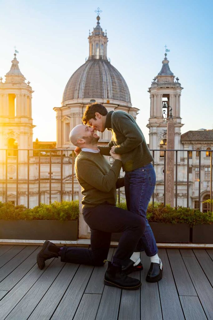 Proposing at sunset on a rooftop terrace with a stunning roman skyline view and church in piazza navona