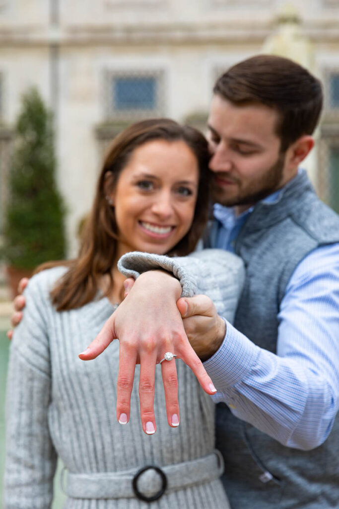 Just engaged picture of a couple displaying the engagement ring