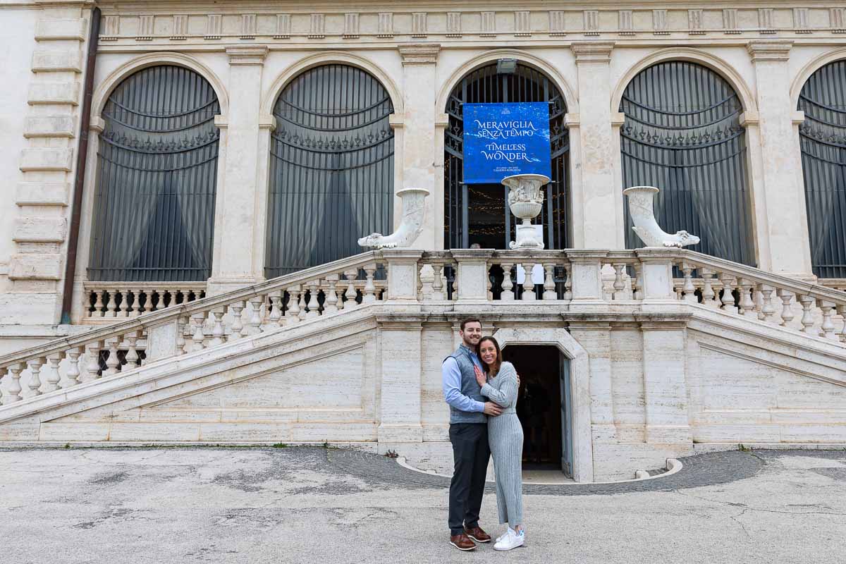 Couple portrait standing in front of the Galleria Villa Borghese museum in Rome Italy