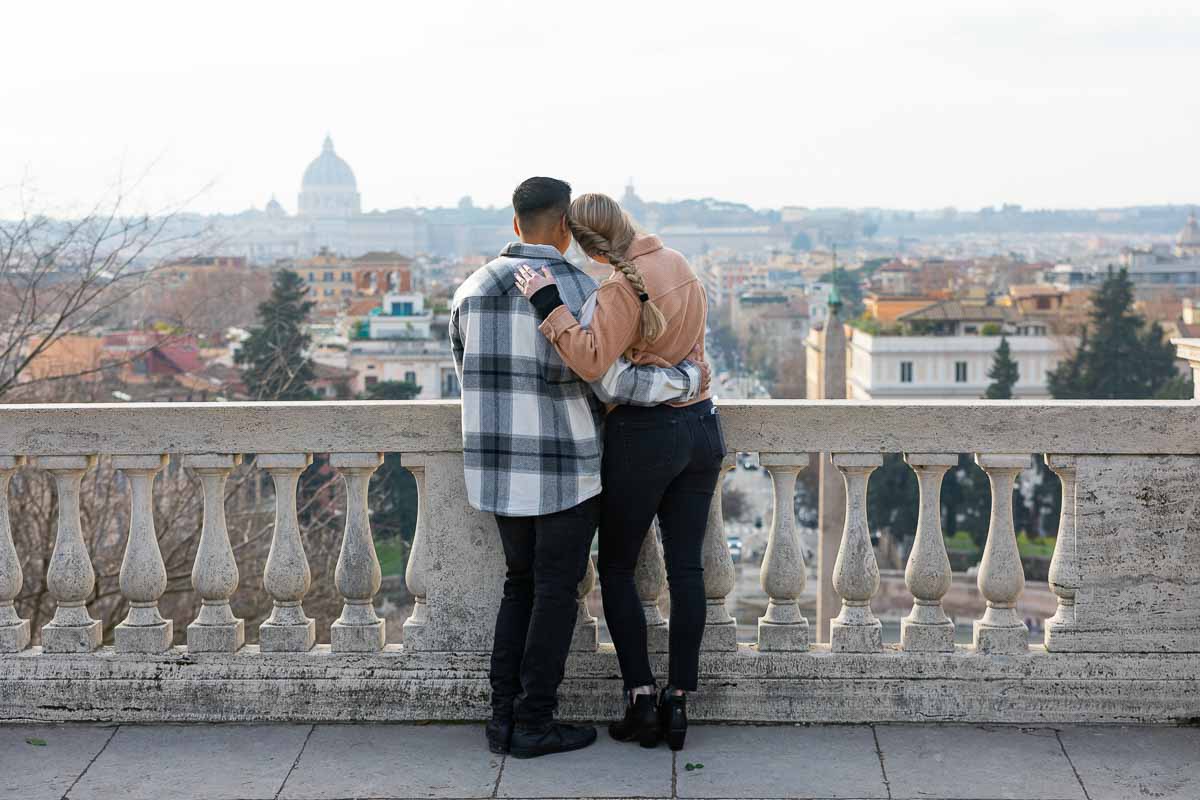 In love in Rome Italy. Couple looking at the panorama together