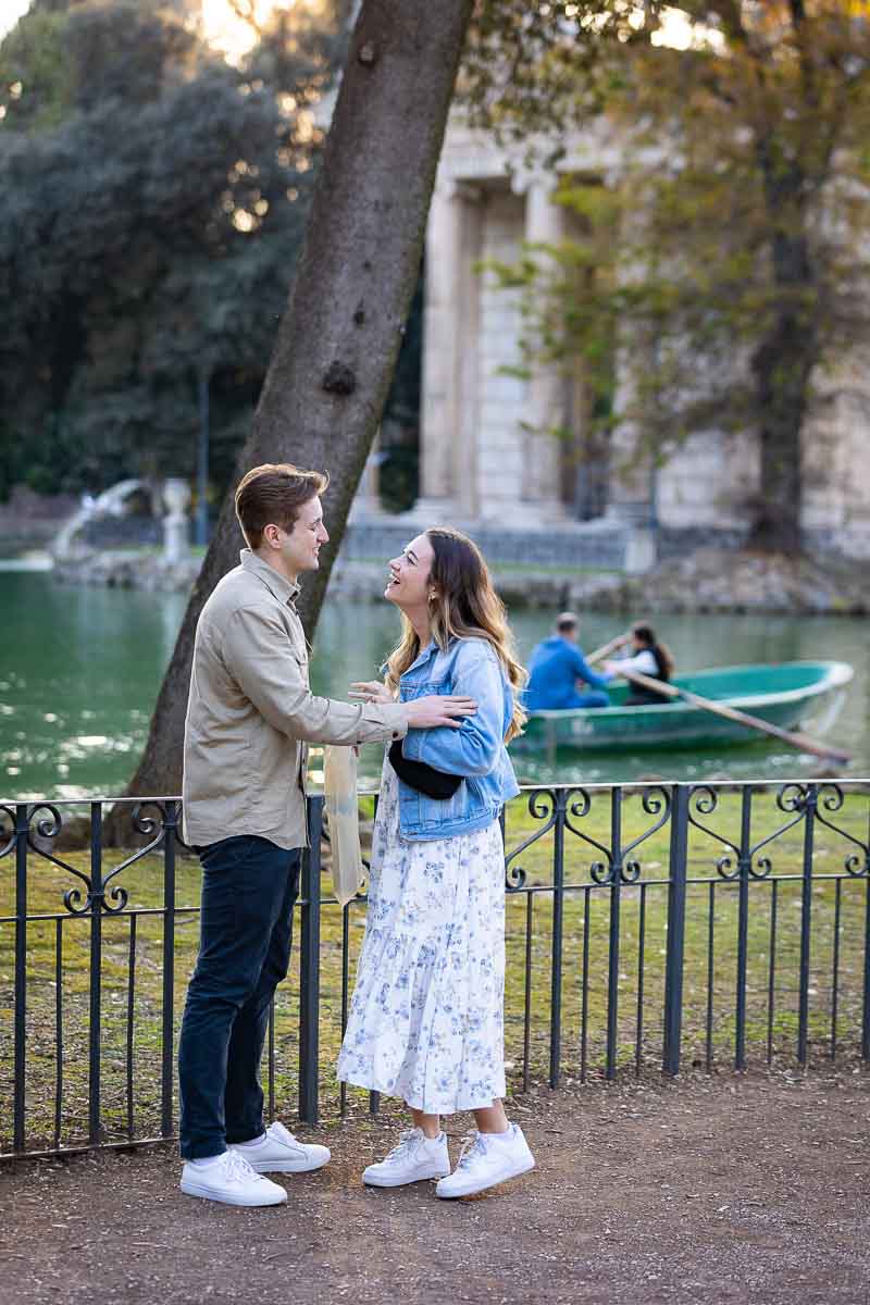 Surprised by a wedding proposal while walking by the lake in Villa Borghese. Rone, Italy.