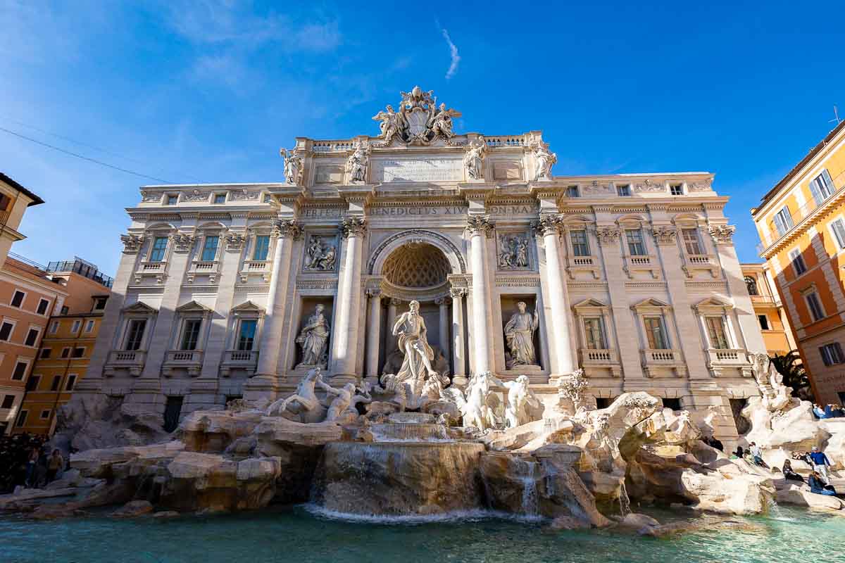 The Trevi fountain. Frontally photographed during the golden hour just prior to sunset