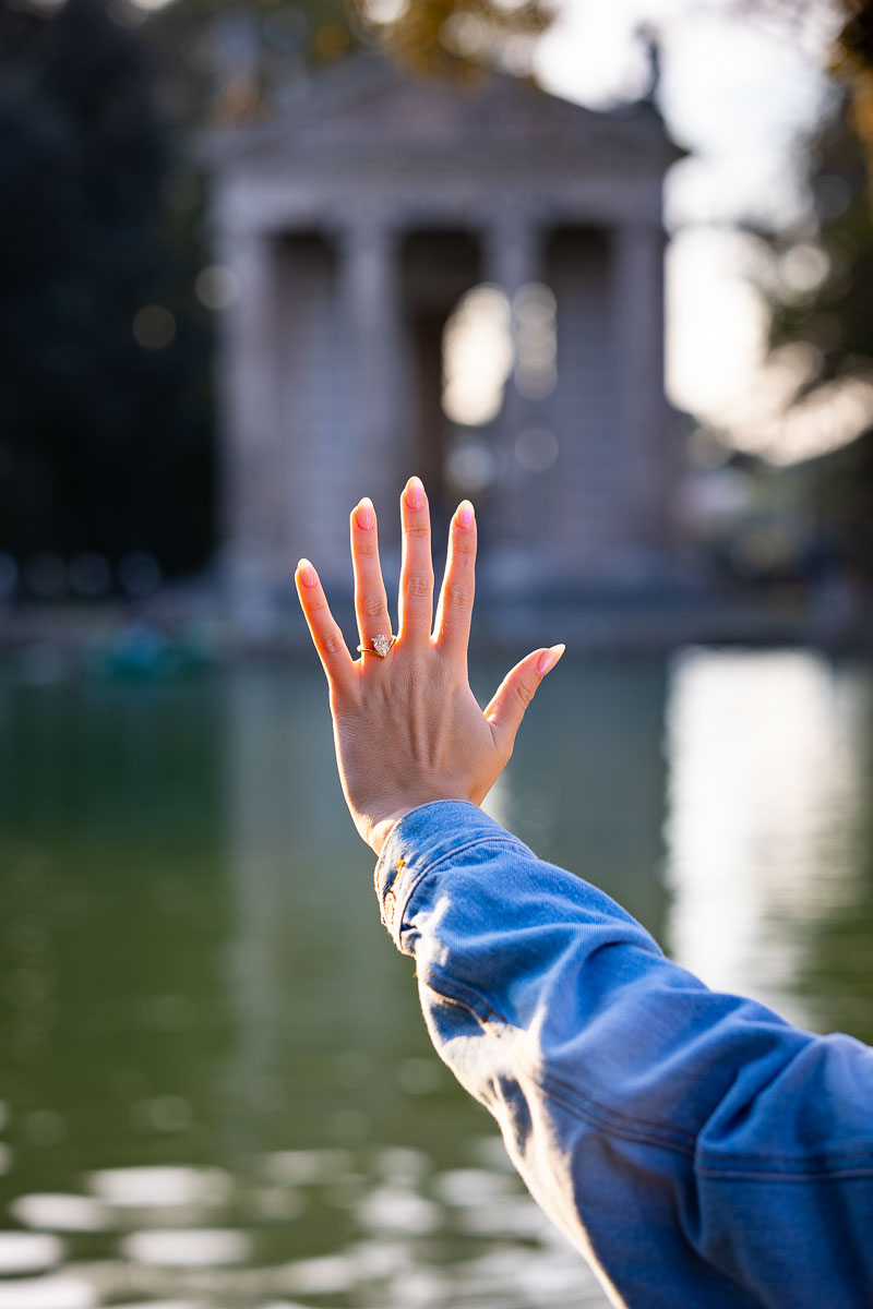 Image of engagement ring photographed before the temple in the distance