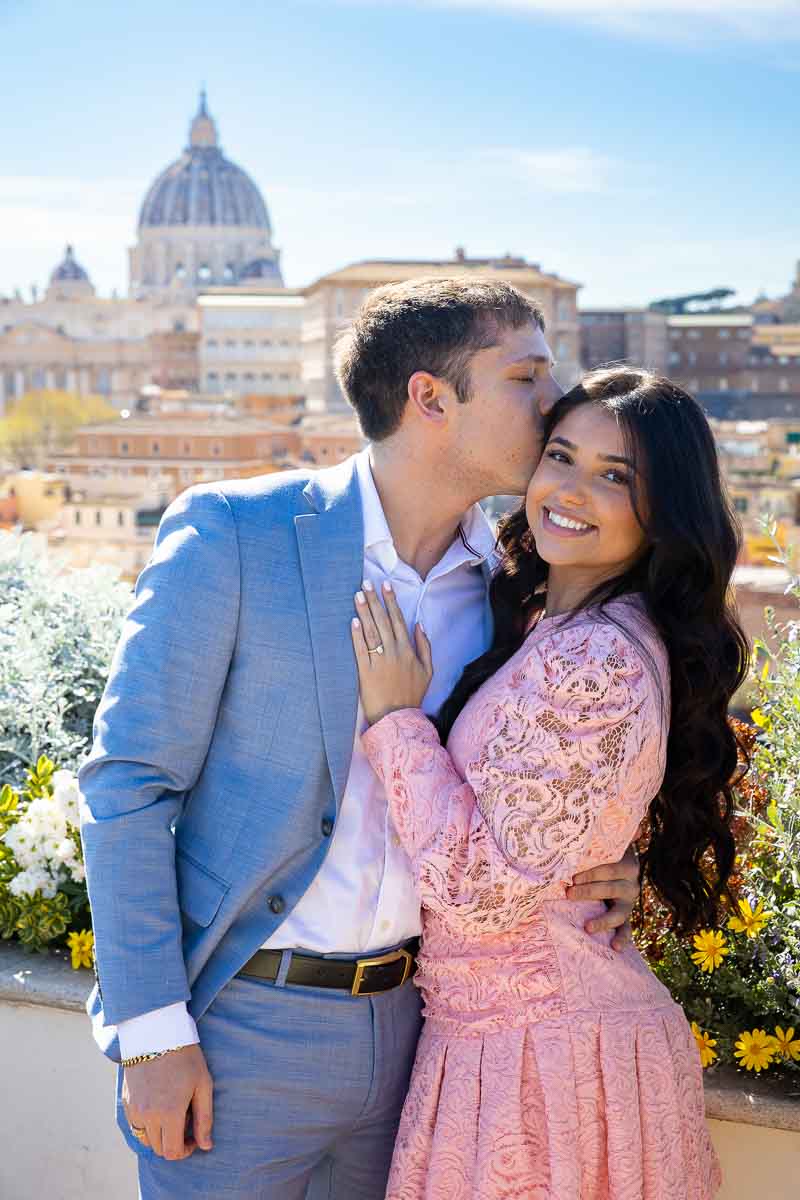 Couple portrait in front of the roman rooftop view from above 