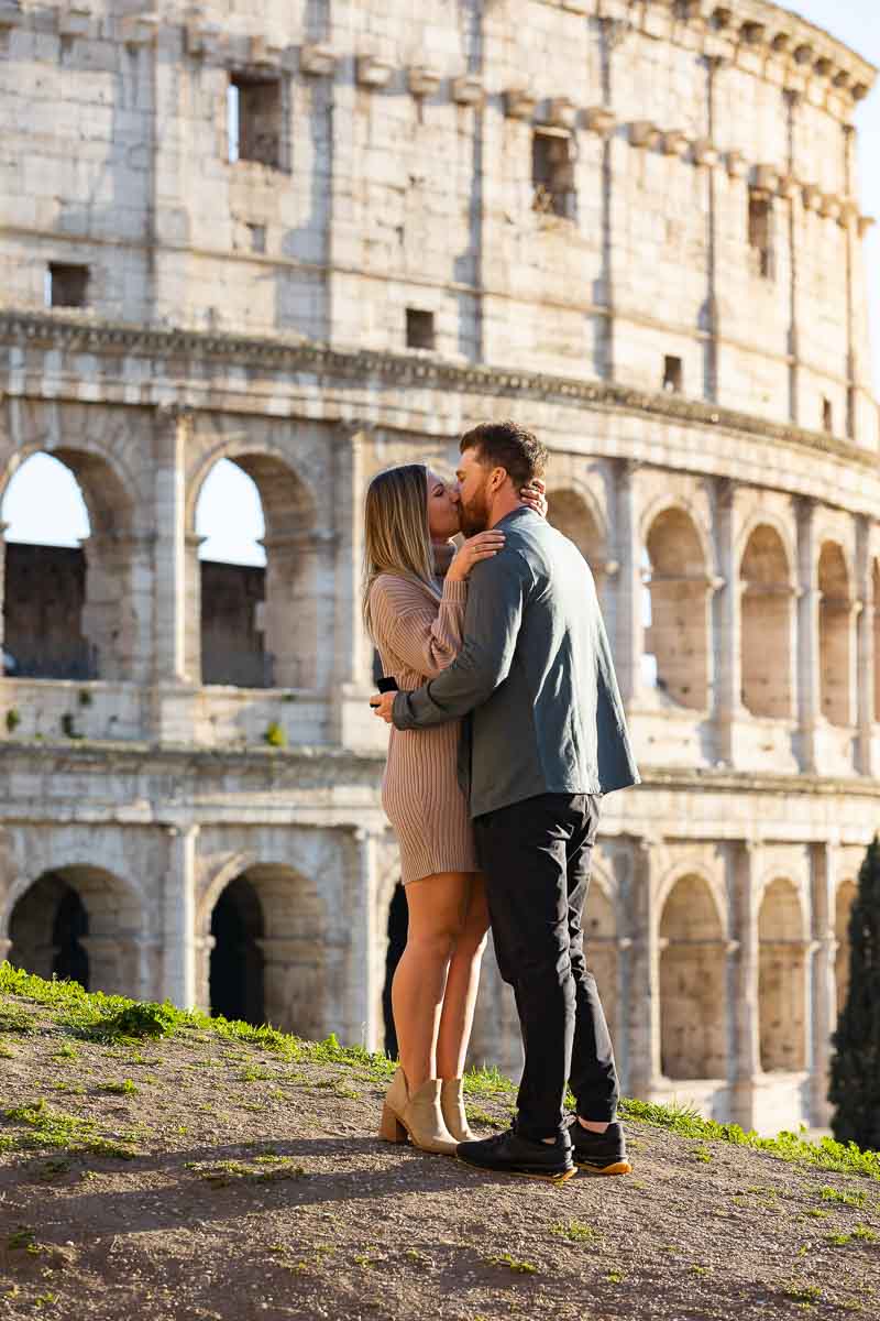 Couple together during the say yes moment in front of the Colosseum