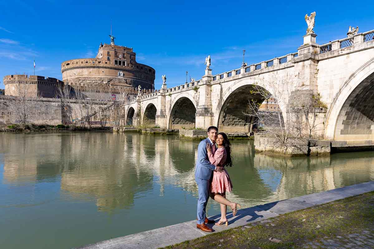 Couple portrait photographed underneath Castel Sant'Angelo by the roman Tiber river