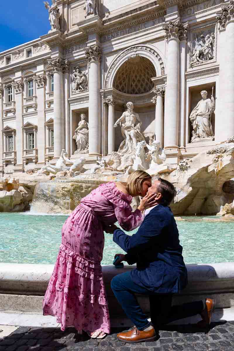 Just engaged in Rome at the Trevi fountain. Kissing moment