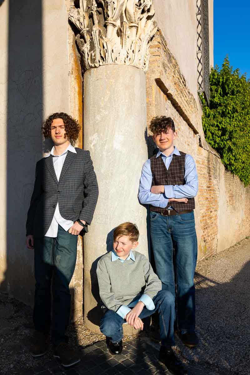 Kids group portrait taken under a roman column in Rome Italy