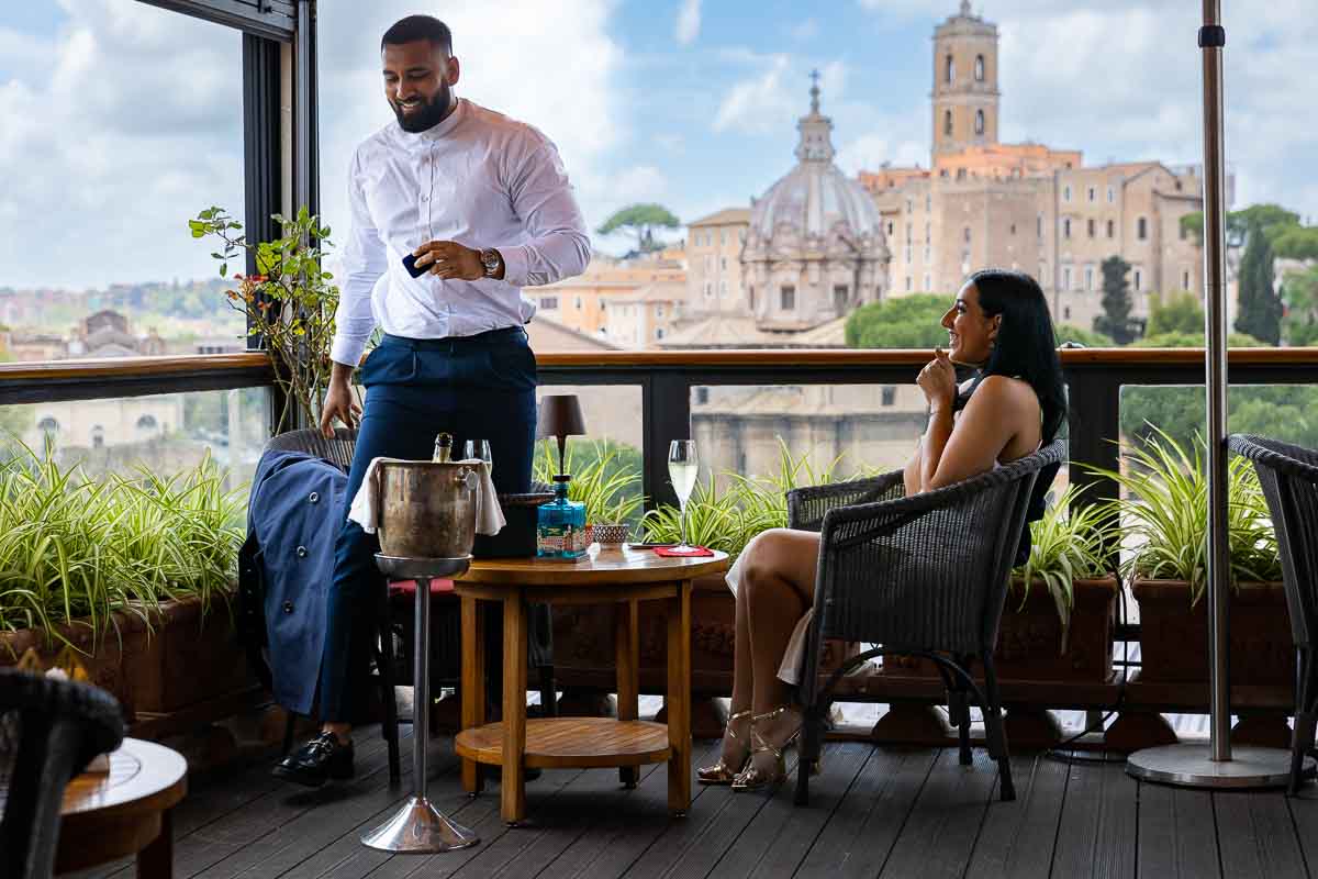 Preparing to propose on a terrace with a beautiful view over the ancient city of Rome