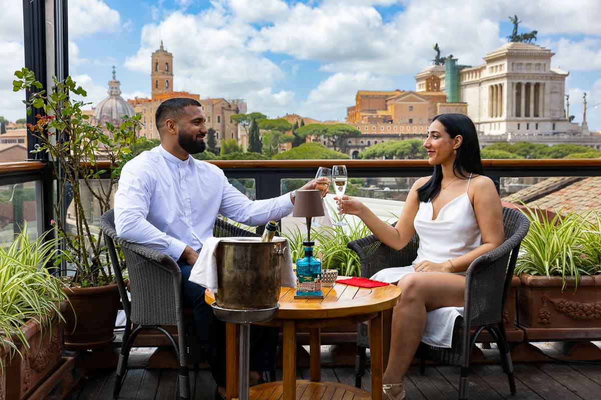 Toasting and celebrating engagement in Rome during a couple photo shoot