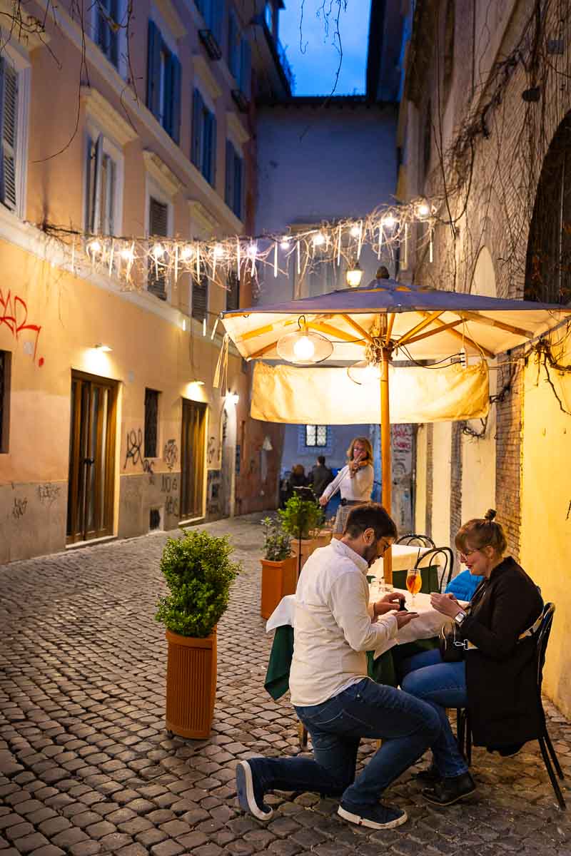 Restaurant Surprise Proposal in Rome photographed on the street of a restaurant in the heart of Trastevere 