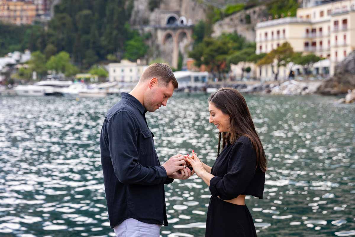 Putting the engagement ring on during a romantic amalfi coast vacation