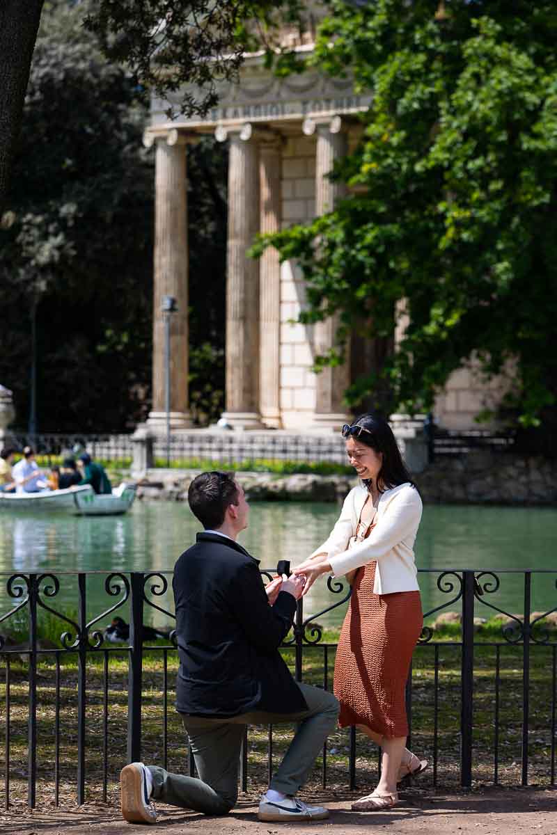 Proposing in Rome. Surprise wedding proposal photography candidly shot from a distance