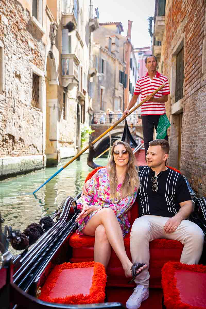 Together visiting Venezia on a gondola ride in the water canals