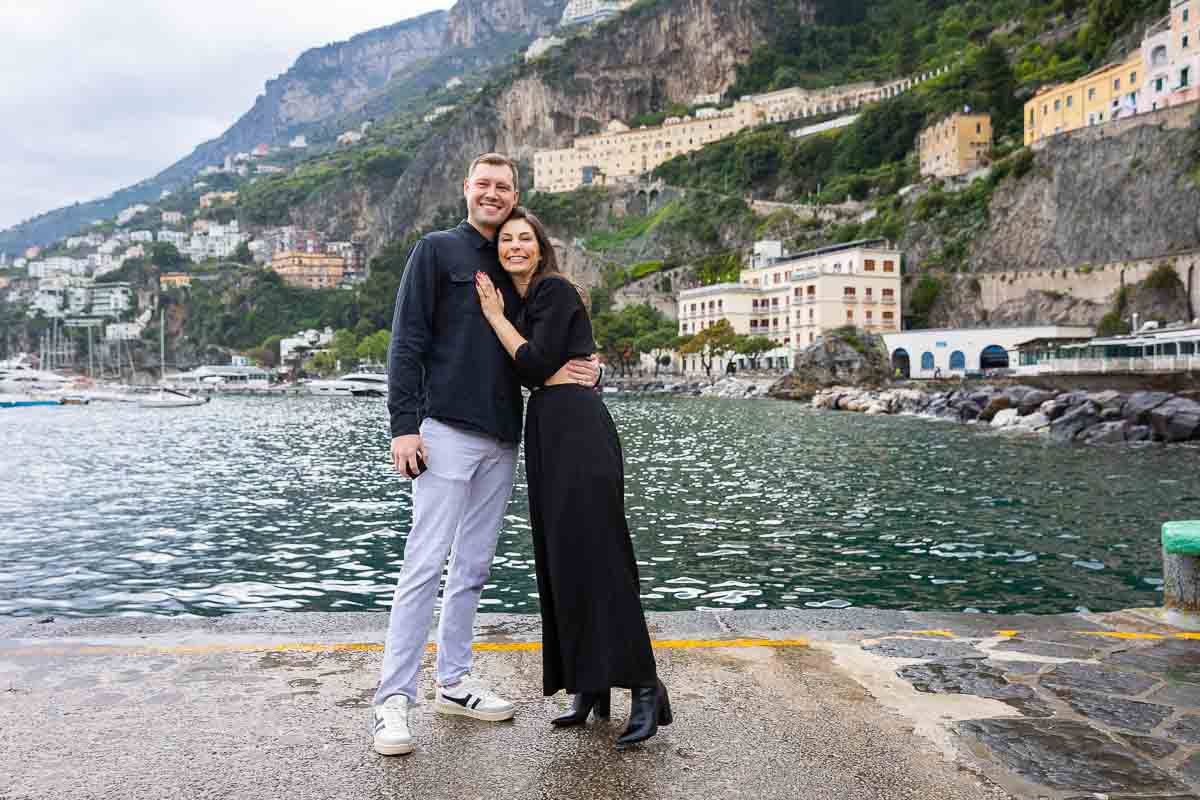 Couple portrait picture posing in front of the town and the mediterranean sea