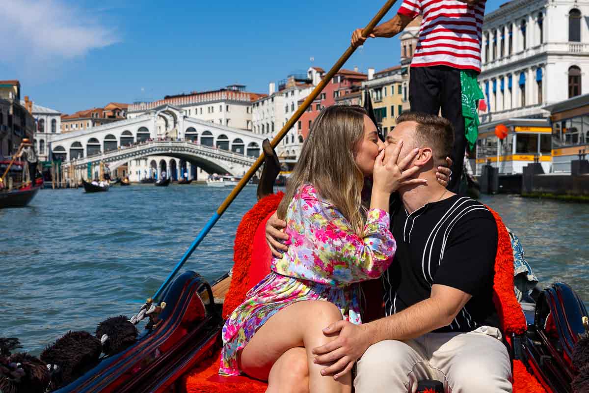 The she said yes moment. Couple kissing during an surprise proposal in Venice