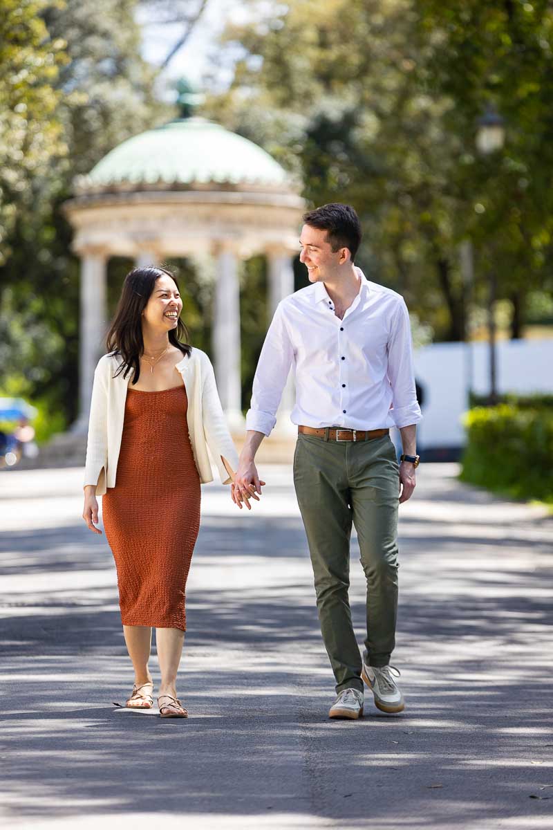 Walking in Rome holding hands in hands while on an engagement photoshoot 