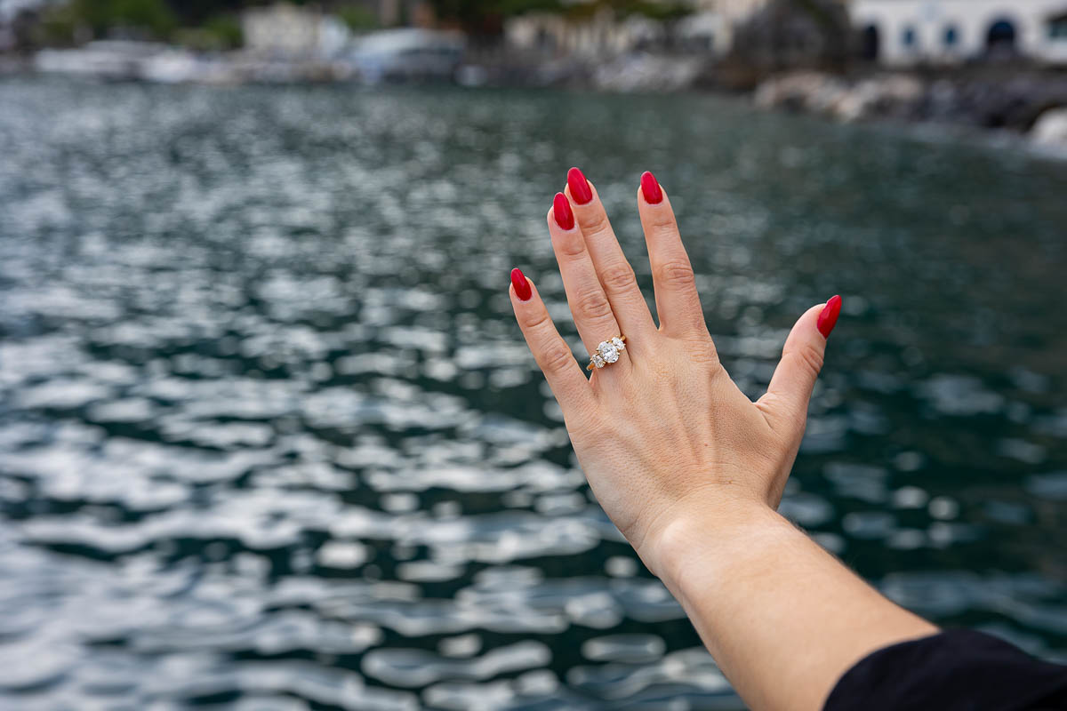 Looking at the amazing engagement ring during a couple photoshoot