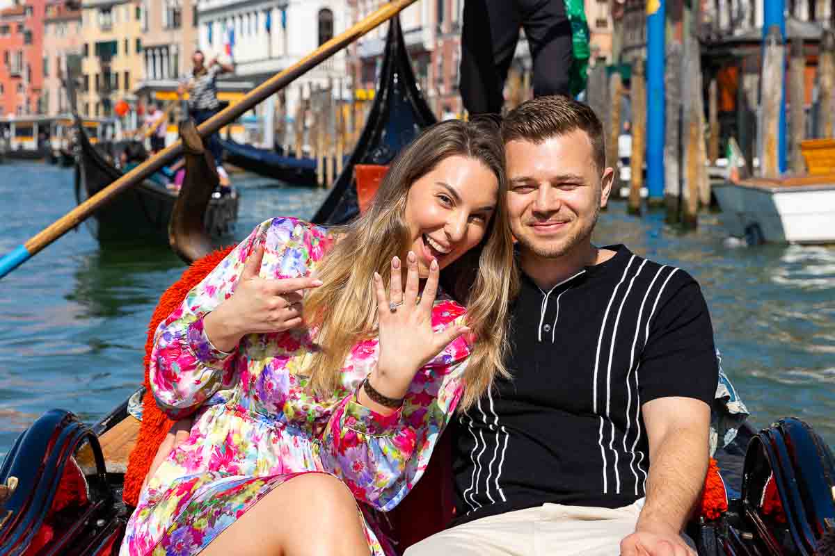 Couple showing off the beautiful engagement ring