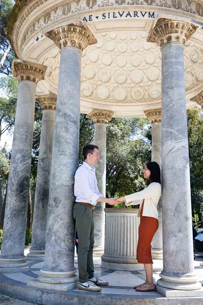 Couple taking photos inside the Temple of Diana. Rome, Italy