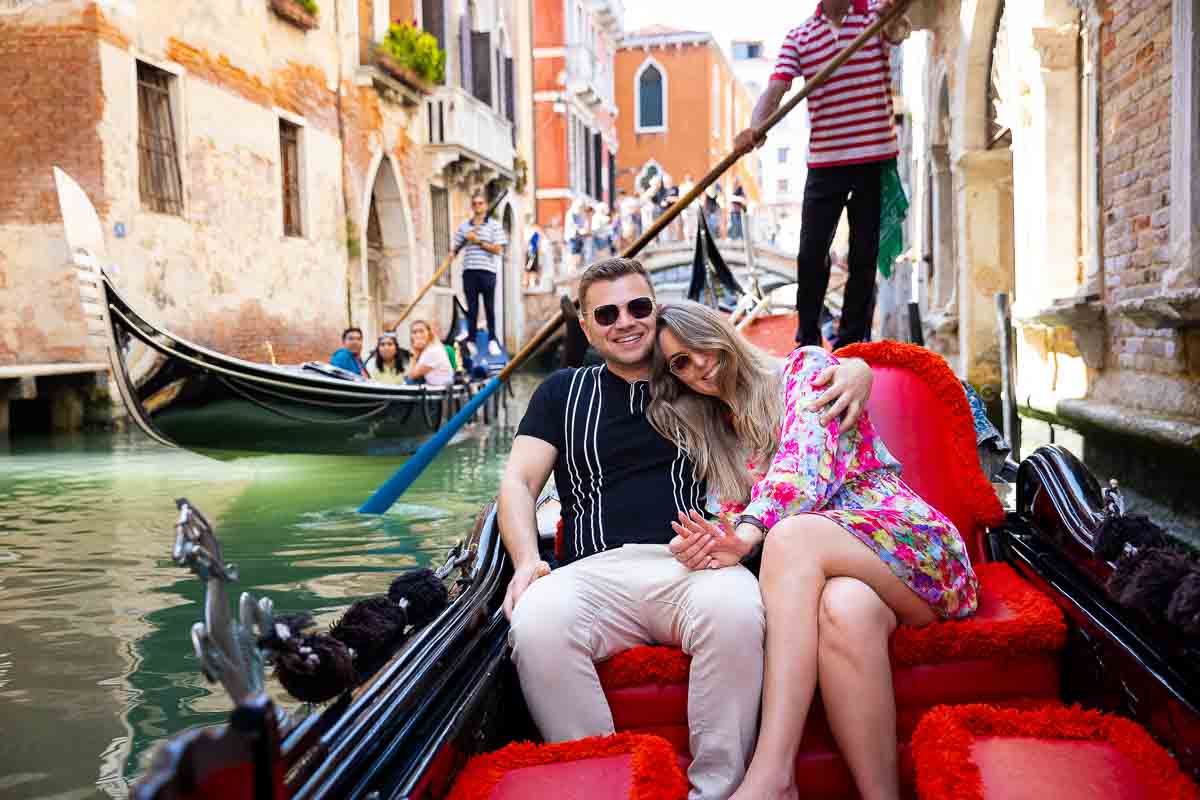 Admiring the engagement ring during a ride through the canals. Venice Gondola Proposal Photography 