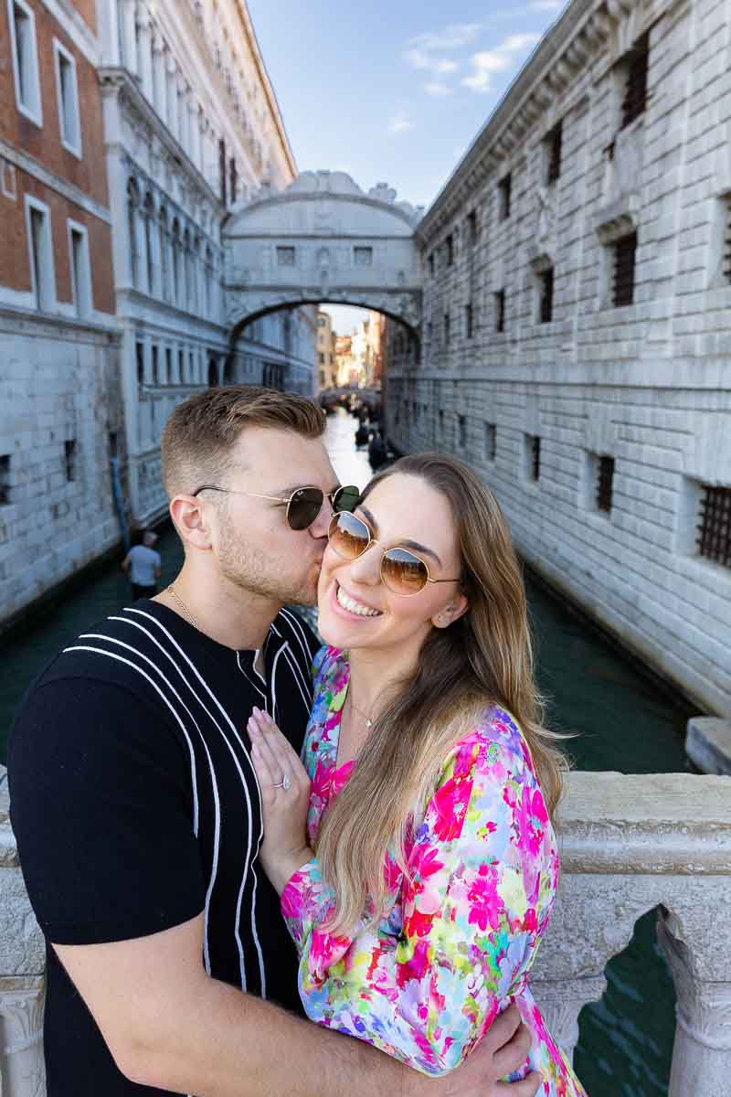Kissing by the bridge of Sighs during a photo session